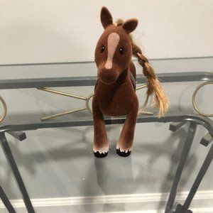 Pony with long hair and a long tail color blond.